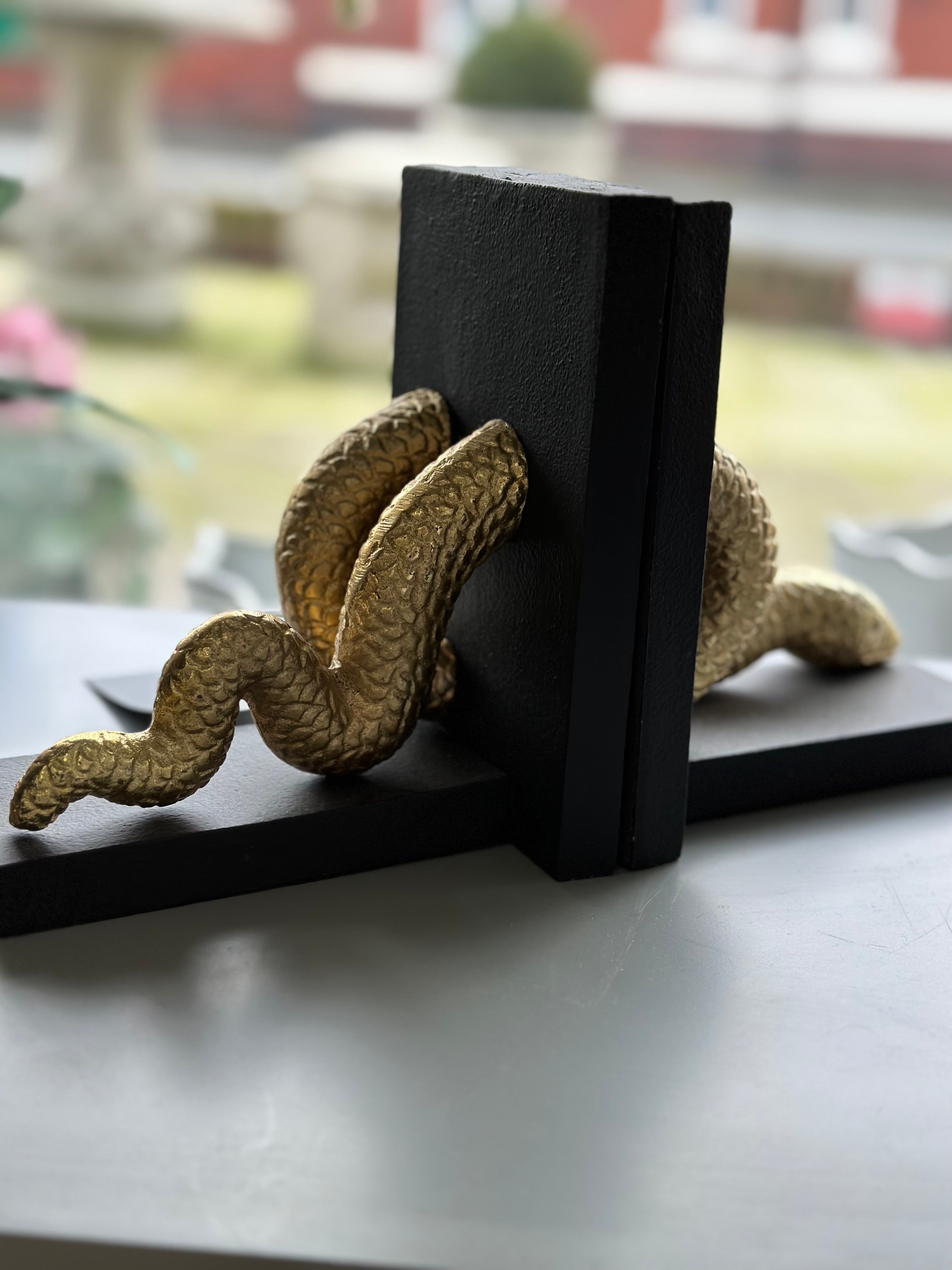 Gold and black serpent bookends