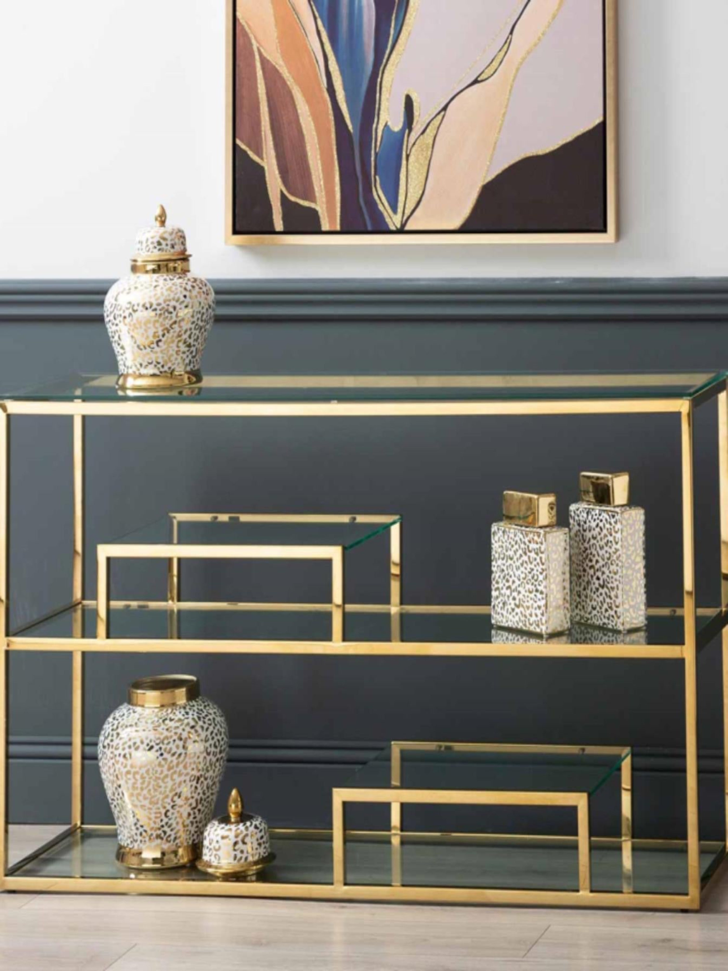 Gold and glass multi tiered shelving unit
