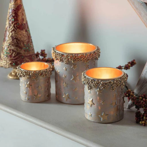 The Pernu Votive Tealight Holder adds a touch of rustic sophistication to any space with its antique gold finish